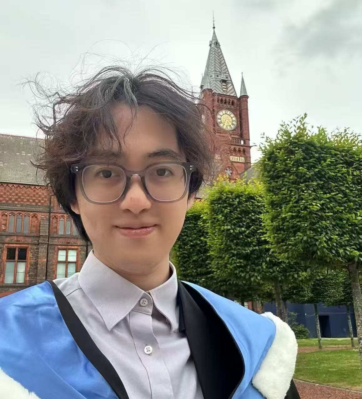 Jiacheng Zhang in graduation attire